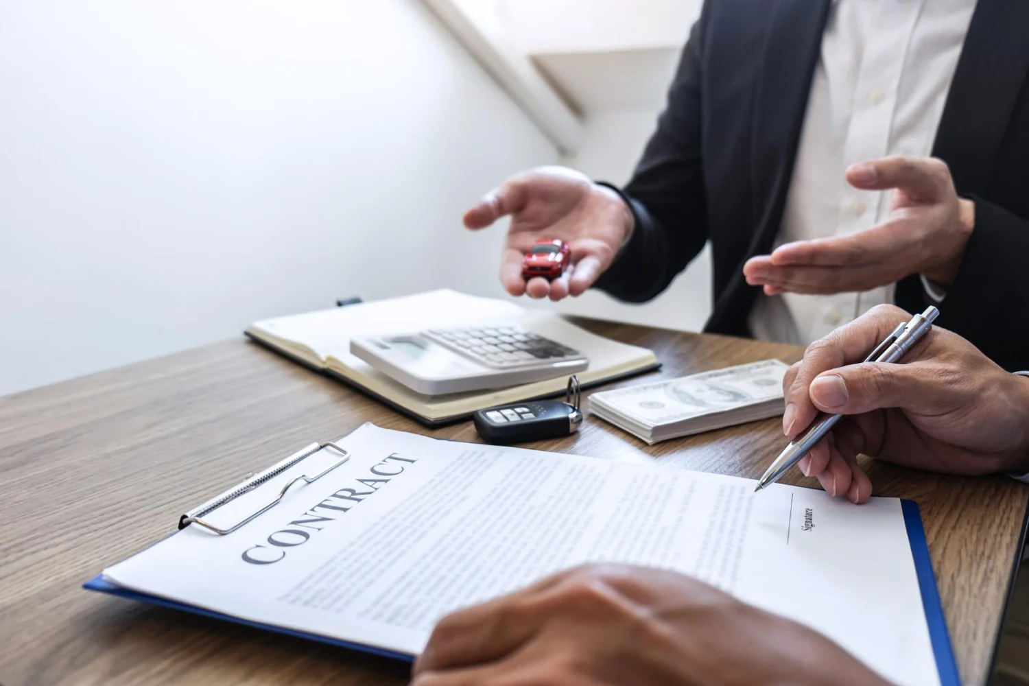 A business owner and an advisor reviewing a contract together