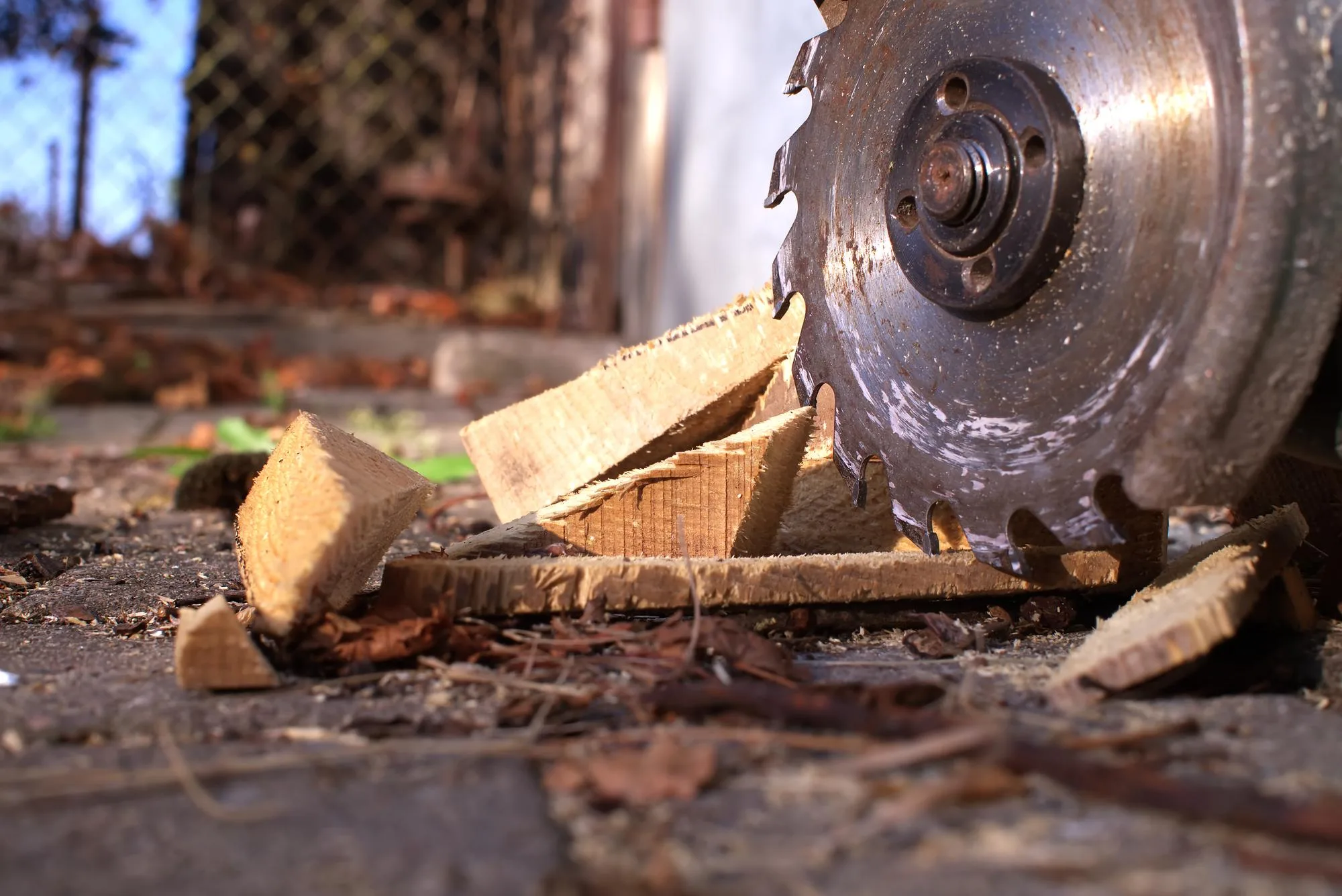 Circular saw blade cutting through wood on a job site