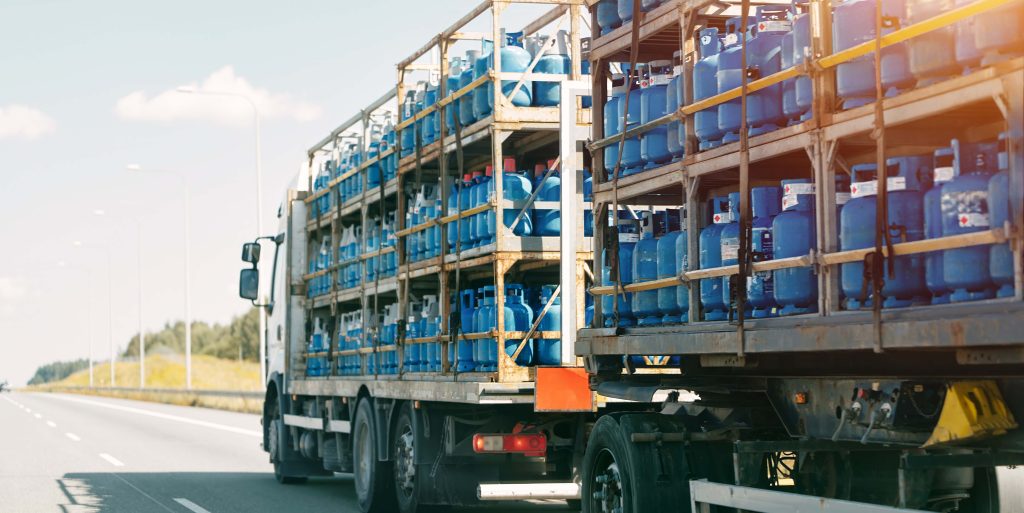 Truck carrying propane tanks on highway
