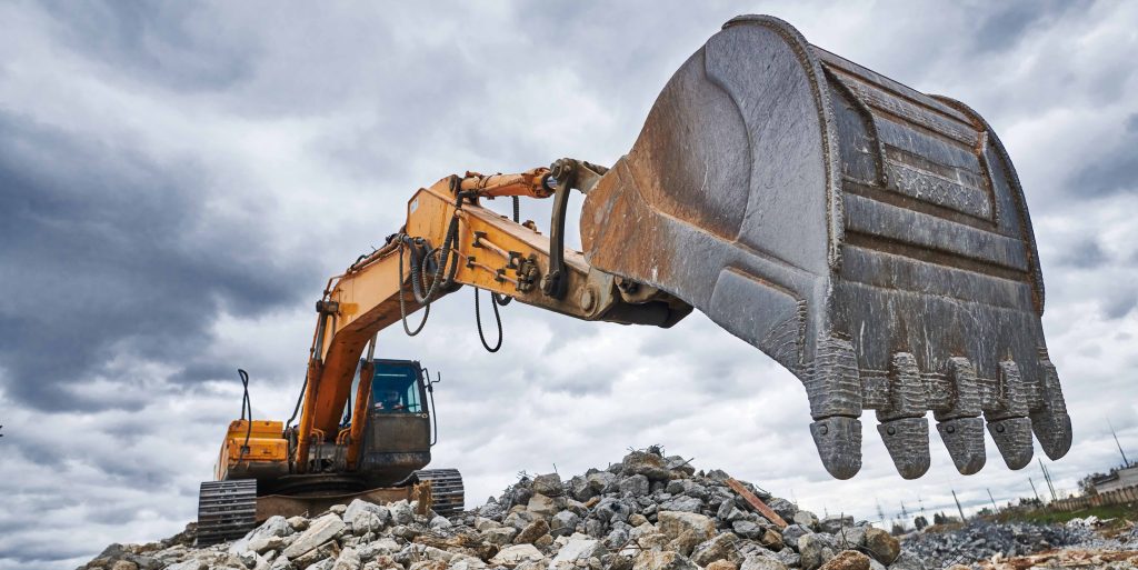excavator loader machine at demolition construction site