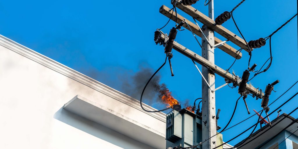 power pylon overload or electric short circuit at transformer on