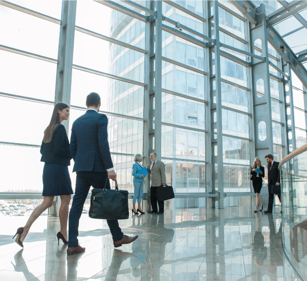 Business-professionals-walking-hallway Business professionals walking in modern office