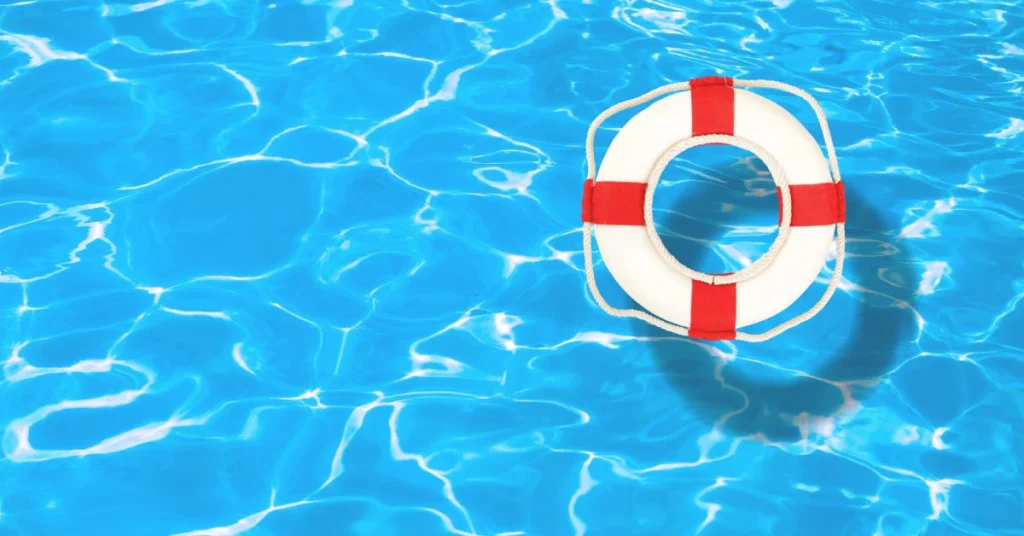 Life preserver floating in clear pool water Life preserver floating in clear pool water