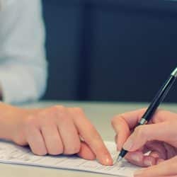 Cleaning & janitorial professional reviewing contract with client
