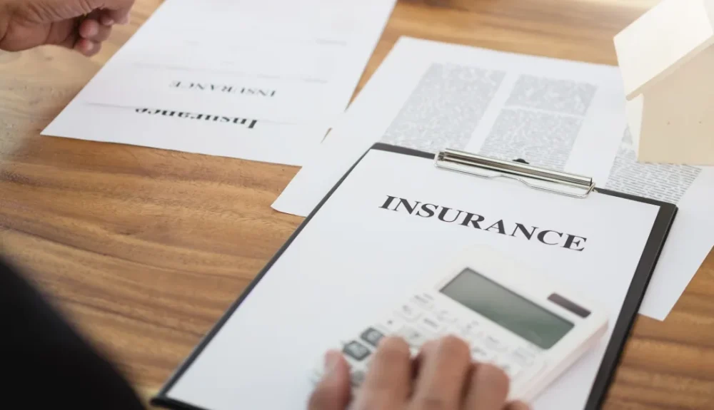 A client reviewing an insurance policy on a clipboard