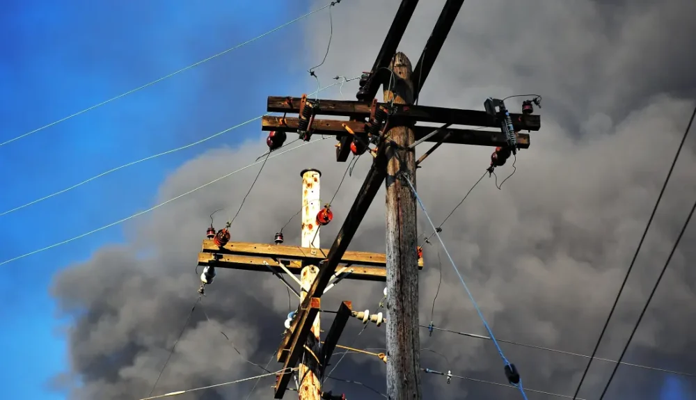 Low-angle view of a utility pole with power lines