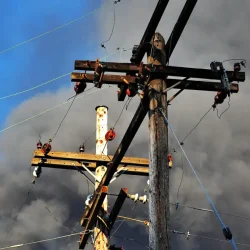 Low-angle view of a utility pole with power lines