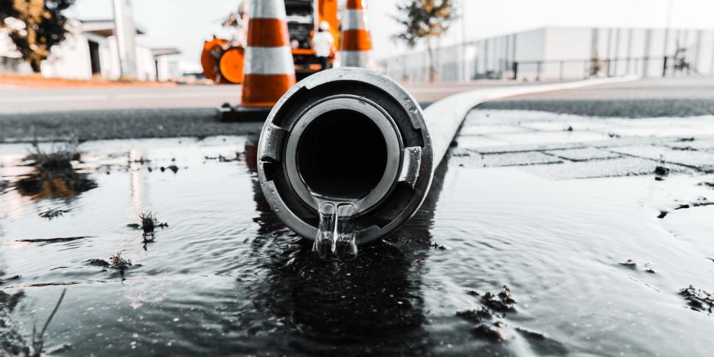 gray-pipe-with-water-coming-out-its-hole
