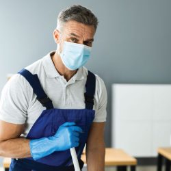 Janitorial maintenance worker with PPE