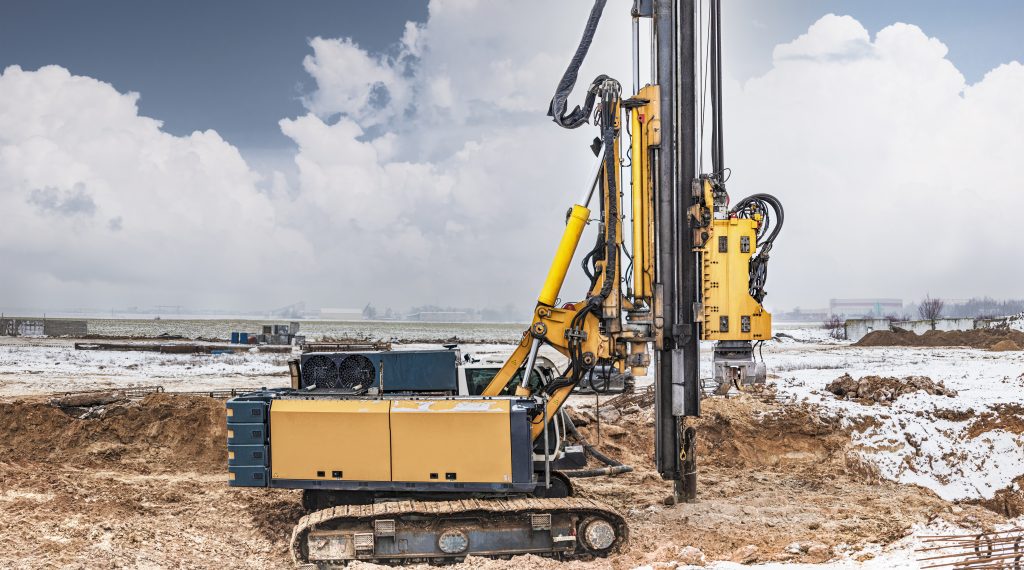 A powerful drilling rig for peeling at a construction site. Operation of the drilling rig in northern conditions. Pile foundations. Bored piles.