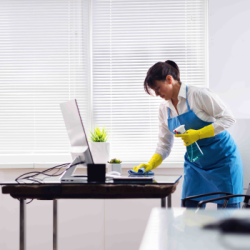 Maintenance worker cleaning an office