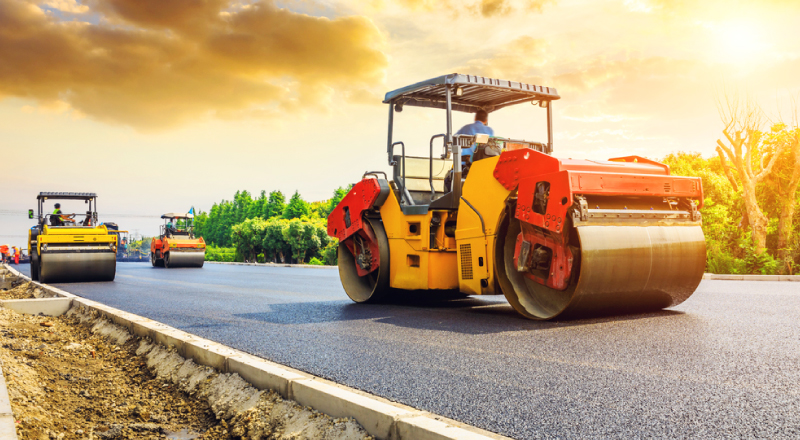 steamroller-flattening-asphalt Road roller grading asphalt