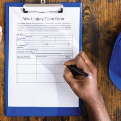 Employee filling our Workers' Compensation claim form