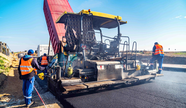 workers-paving-road Workers asphalting road